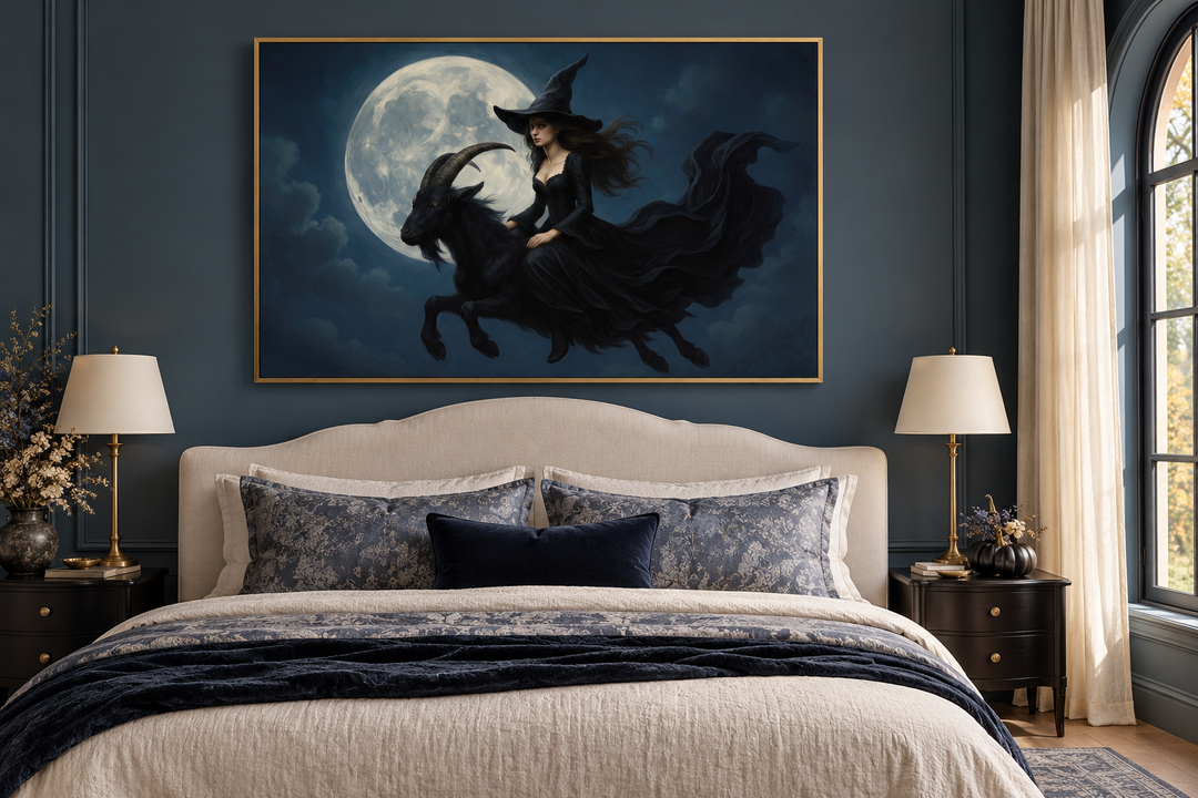 Witch flying on a black goat against a full moon in a gold frame above a bed in a dark blue room.