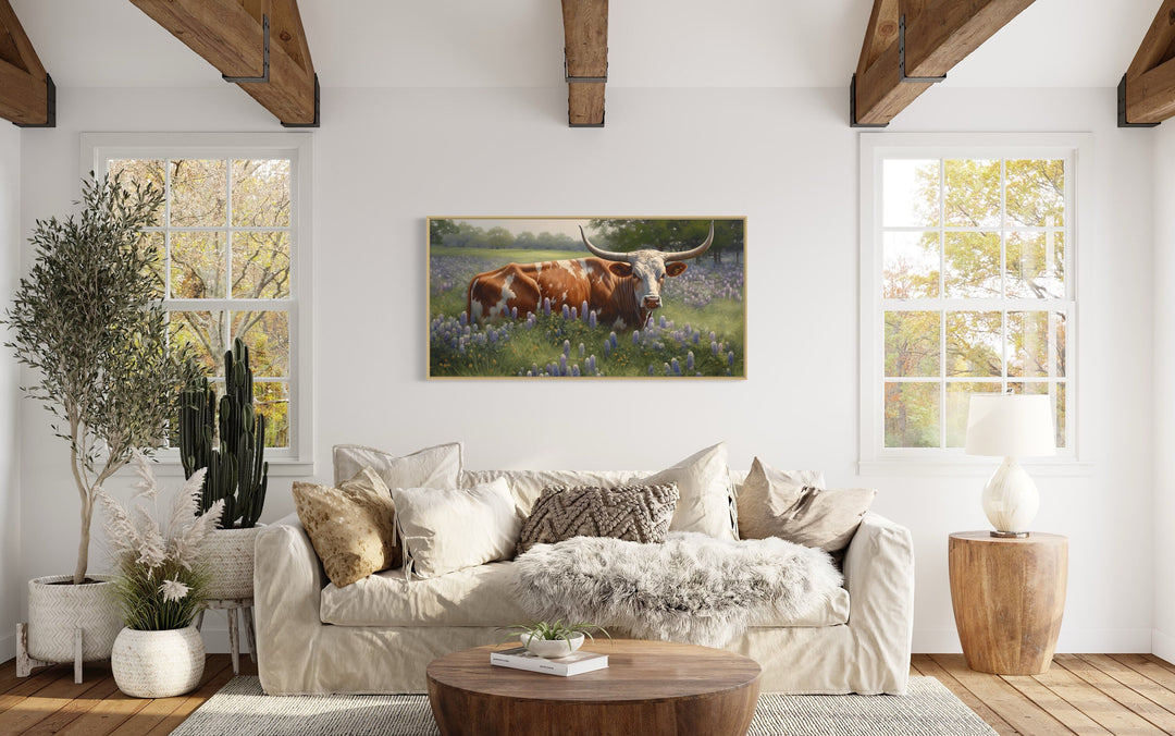 Texas Longhorn In Bluebonnets Wall Art "Springtime Serenity" over beige couch