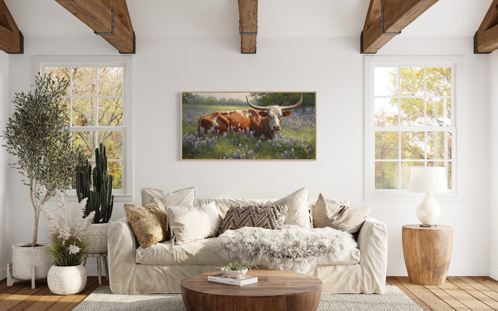 Texas Longhorn In Bluebonnets Wall Art "Springtime Serenity" over beige couch