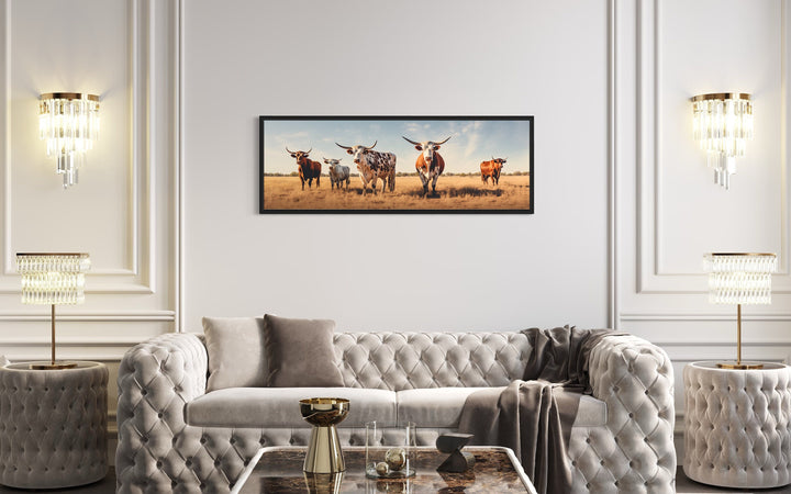 Herd of Texas Longhorn Cows Panoramic Wall Art "Quintet Horizon" over modern white couch