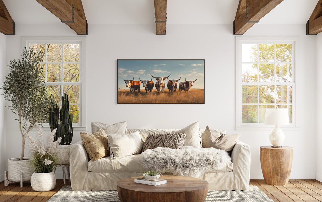 Texas Longhorns Herd In The Field Wall Art "Cattle Gathering" over beige couch