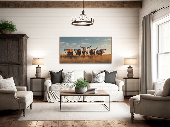 Texas Longhorns Herd In The Field Wall Art "Cattle Gathering" over rustic couch