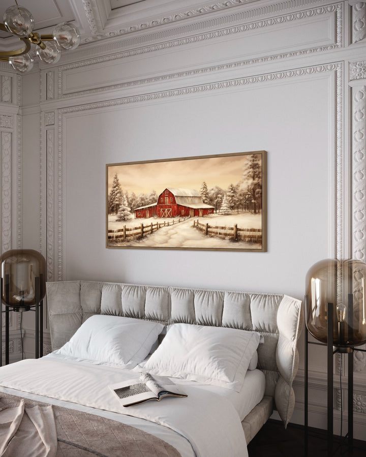 Oak framed Red Barn In Snow Winter Wall Art "Winter Homestead" hanging over modern bed
